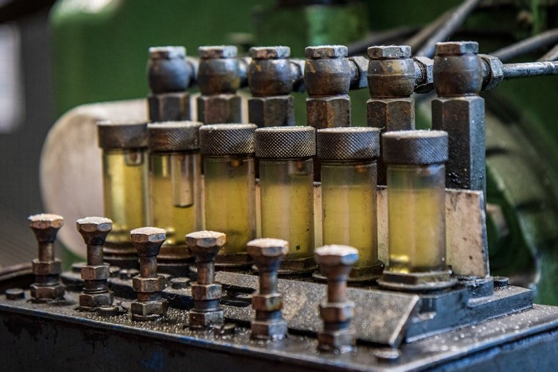 Industrial lubricant oil bottles on machinery
